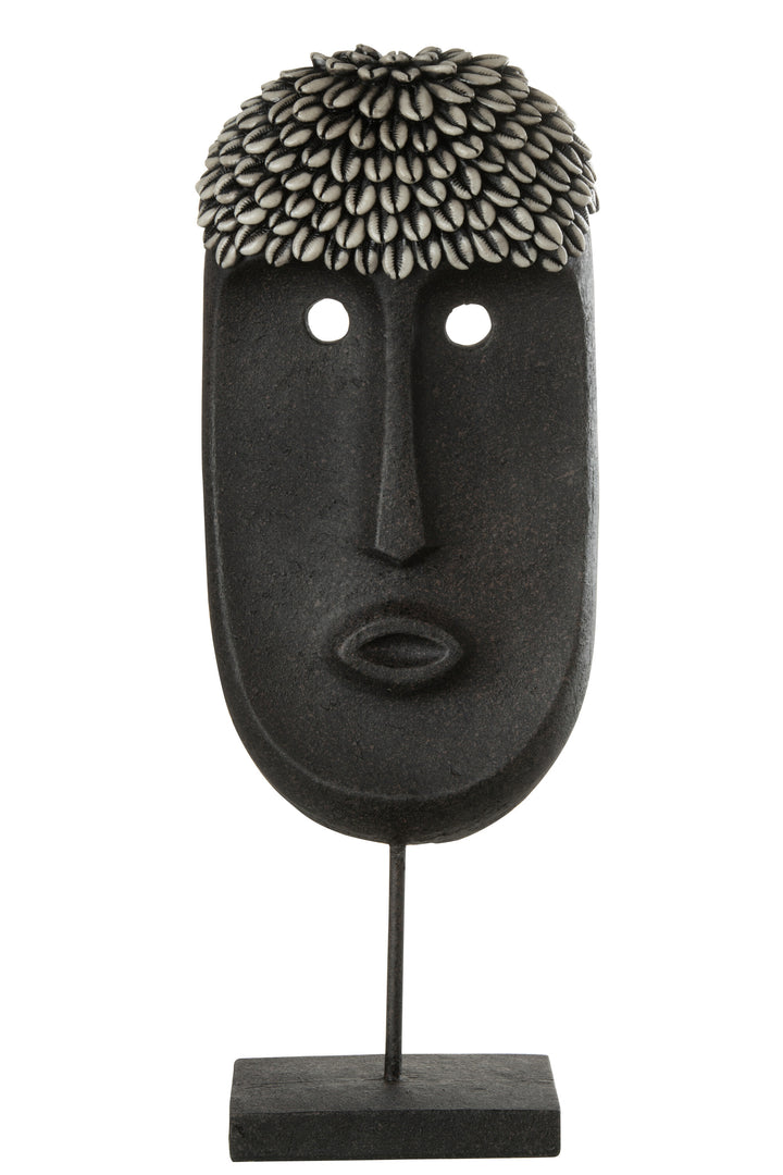 Zulu stand decorative sculpture made from wood with elongated tribal face design in dark tones.